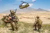 Soldiers from 1st Battalion, 121st Infantry Regiment of the 48th Infantry Brigade Combat Team provide security as a CH-47 Chinook helicopter lands after a key leader engagement in Southeaster