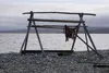 Salmon dries on a traditional rack on the beach in the Seward Peninsula village of Teller on Sept. 2, 2021. Salmon is a dietary staple for Indigenous residents of Western Alaska, and poor run