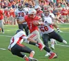Wasilla running back Zachary Garnett (1) eludes Juneau-Douglas defensive back Manase Maake (3) and defensive lineman Kaelin Deitrick (56) during the Warriors 35-22 win over the Crimson Bears 
