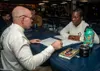 U.S. Navy Command Master Chief Casey Wheeler, left, from Wasilla, Alaska, advises Aviation Boatswain's Mate (Handling) 1st Class Katrena Rozier, from Miami, during a letter-to-the-board revie