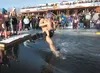 Macho Libre team member Jaun Ortiz takes the plunge into the cold water of Wasilla Lake Saturday afternoon during the 2013 Mat-Su Plunge. More than 125 jumpers turned out to raise more than $