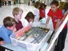 Submitted photo A Larson Elementary School student explains the
Parks Highway interchange project through a model during a learning
fair held at the school last week.
