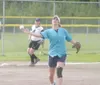 JEREMIAH BARTZ/Frontiersman Pitcher Sherry Robinson makes the
throw back to first base for the Robinson Millwork women's softball
squad.