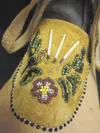 Palmer High School student Kirsten Swort won third place in this
year’s All State Art Competition for this pair of mukluks, she
constructed from found and traditional materials.(Photo courtes