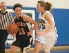 Kenai’s Justice English tries to get past Palmer’s Kourtney Straight during Thursday’s game at Palmer High School. ROBERT DeBERRY/Frontiersman.com