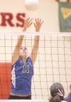 ROBERT DeBERRY/Frontiersman Palmer'€™s Jaimi Cox stretches for
the block during Thursday'€™s match against the Kenai Kardinals at
the Northern Lights Conference Championships at Wasilla High
