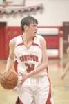 Houston captain Logan Moore looks to move the aball toward the
basket during a loss to Ketchikan earlier this season. Houston head
coach Dave Porter said the emergence of Moore and J.T. Thomp