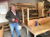 Nate Hollen is the Nate in Nate’s Woodshed, and his woodshed is the garage of his Wasilla home. Jeremiah Bartz/Frontiersman