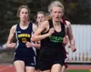 Colony runner Coleen Geraghty leads the girls 800-meter field in Saturday's Kenai Invitational at Ed Hollier Field in Kenai. (Photo by Joey Klecka/Peninsula Clarion) Joey Klecka/Peninsula Cla
