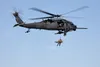 Alaska Air National Guard HH-60G Pave Hawk helicopter aviators assigned to the 210th Rescue Squadron hoist a 212th Rescue Squadron pararescueman and simulated casualty during a capabilities e