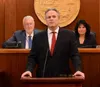 Gov. Mike Dunleavy said that he will introduce an Executive Order establishing the Alaska Department of Agriculture during the January legislative session. Behind him are Senate President Gar