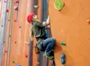 Noah Samuelson looks for the next hand hold while climbing a route at the Rock On Climbing Gym in Wasilla Friday evening. ROBERT DeBERRY/Frontiersman.com