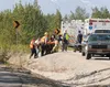 Emergency responders carry the driver of a motorcycle that crashed on the Old Glenn Highway near mile 13 Friday afternoon. Life Med air ambulance was called in to transport the rider to Ancho