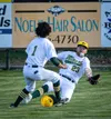 Mat-Su's Maddox Haley slides to try to make a catch during a win over Chugiak. Courtesy of Bryan Boyett