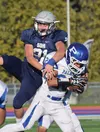 Palmer defensive back Jared Oviok intercepts a pass meant for Soldotna's Levi Hensley (21) early in Friday evening's Northern Lights Conference game at Justin Maile Field in Soldotna. Joey Kl
