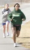 Colony sophomore Valencia McPhail leads fellow sophomore Laura
Maresh around the track during practice Monday at Colony High
School. The Knights go into the spring track and field season with
