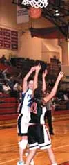 Palmer senior Emily Bolling drives the ball past Kenai's Breezy
Saltsgiver during Palmer's 42-40 win over the Kardinals during
first-round action of the Region III championship tourney Thursd