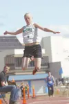 Colony's Sierra Hodgson gains altitude and distance on her third
attempt during the triple jump event at Saturday's Region III track
meet at Palmer High School. Hodgson won both the long and 