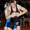 Wasilla's Chris Odom tries to escape the grasp of Homer's Monte
Garroutte during the 135-pound final. Photo by JEREMIAH BARTZ/
Frontiersman.