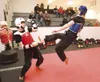 Matthew McConarty and Jesse Shearer practice sparring Saturday
at Primal Marshal Arts in Wasilla. (ROBERT
DeBERRY/Frontiersman)