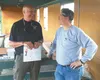 Retired Alaska State Trooper Lt. Jeff Hall, left, and active Capt. Barry Wilson share a laugh at Saturday’s shooting competition at the Birchwood Recreational Shooting Range in Chugiak on Sat