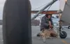With valley winds gusting over 50 mph, William Frantz, Meadow Lakes, ties down his 1969 Champion Explorer at the Wasilla Airport during Saturday's high winds. Frantz commented that he thought