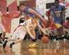 Houston Hawk Jamison Richey scrambles after a loose ball during Saturday's game against the Lathrop Malemutes at Houston High School. Robert DeBerry