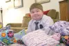 Sam Allred with some of the comfort pillows he donated to Providence Regional Hospital in July. HEATHER A. RESZ/For the Frontiersman