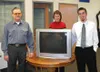 Willie Bragg, left, accepted his 27-inch television as the grand
prize winner from Tracy Ressler, the Frontiersman business manager,
and Rent-A-Center store manager Brian Eddy. Photo by CASEY