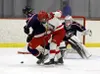 Wasilla forward Chase Schacle knocks the puck away from a North Pole defenseman during a 9-3 win over the Patriots. Photos Courtesy of Bruce Eggleston/matsusports.net