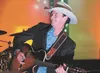 Ken Peltier, along with the Ken Peltier Band, entertains the crowd at at last year’s Santa Cop and Heroes Barn Dance fundraiser at the Curtis D. Menard Memorial Sports Center in Wasilla. ROBE