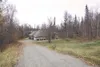 One of several houses purchased by the Mat-Su Borough for the
Bogard Road extension sits boarded up. Borough Mayor Larry
Devilbiss vetoed an ordinance that would have begun the eminent
domain