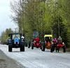 Chilly temperatures, cloudy skies, and the threat of rain could not deter the nearly 30 tractors that gathered for the annual “Drive Your Tractor to Work” day on May 6. Katie Stavick/Frontier