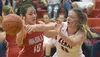 Kenai Central's Kailey Hamilton passes past Wasilla's Carissa Vasquez on Wednesday, Feb. 14, 2018, on Cliff Massie Court at Kenai Central High School. Jeff Helminiak/Peninsula Clarion