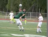 Colony's Chris Olsen and Ben Sande collide in the air, and with Wasilla's Alex Fonov, during Colony's 1-0 win over the Warriors in the first round of the ASAA/First National Bank State Soccer
