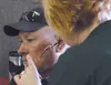 Colleen Zeek applies makeup to a volunteer playing the role of a victim during the Alaska Shield exercises at the Alaska State Fairgrounds in Palmer Friday. The exercise included hundreds of 