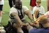 Seattle Seahawks offensive lineman Rees Odhiambo battles Seattle defensive lineman Tylor Harris in the Indian stick pull during the Play 60 Challenge event hosted by the Mat-Su Seahawkers at 