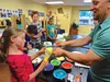 Brandt Bowen shares his cake making talent with the students at Camp Birchtree. Russell Clark/
For the Frontiersman