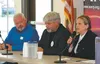 House Seat 11 candidate DeLena Johnson, right, answers a question as fellow candidates Bert Verrall, center, and Richard Best, left, look on during Thursday night's debate in Palmer. (MATT HI