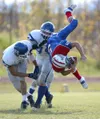 Johnny Wagner/Fairbanks Daily News-Miner North Pole's Steve
Wright, right, is upended by Palmer's Mitch Swetzof, left, and
Jeffrey Mitchell on Saturday afternoon, September 20, 2008, at
Patri