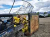 Local volunteer Michael Jones loads trash into a dumpster. Jacob Mann/Frontiersman