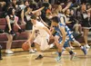 Houston junior Mitchell Ruta drives the ball down the court during a Hawks win over the Cordova Wolverines Thursday at Houston High School. The Hawks split a pair of games against the Wolveri