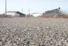 ROBERT DeBERRY/Frontiersman Buttercup Drive in the Meadow Lakes
area has been chip sealed and has held up well. Chip seal is
similar to a typical asphalt paving product, but is less expensive