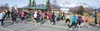 Some of the nearly 200 women who competed in the second annual Who Let the Girls Out 5-kilometer run pass the Palmer Visitor Center right after the start of last Saturday’s race. JENNY WEAVER