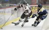 Kenai River’s Porter Schachle works behind the net against Blake Dangos of the Janesville (Wisconsin) Jets on Friday, Oct. 11, 2019, at the Soldotna Regional Sports Complex in Soldotna, Alask