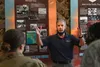 Mr. Don Fenton, Pacific Air Forces chief historian, briefs guests on the history of PACAF highlighting various events and airmen during a 74 th Air Force Birthday Celebration at Joint Base Pe