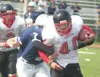 JEREMIAH BARTZ/Frontiersman Houston fullback Tyler Barron tries
to break through the Eagle River defense Saturday in a 59-0 loss to
open the prep football season.