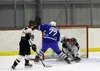 Houston netminder Josh Smoldon makes one of his 40 saves in two periods during 1-1 tie with Palmer. The game was stopped after the second period due to ice conditions,. Courtesy of Bruce Eggl