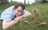 ROBERT DeBERRY/Frontiersman Valley Arts Alliance board member
and artist Carmen Summerfield with her cast iron dandelion
sculpture.