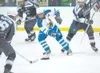 ROBERT DeBERRY/Frontiersman Palmer forward Michael Hanson weaves
his way through a trio of Soldotna Stars during Saturday’s game at
the Palmer Ice Rink.
